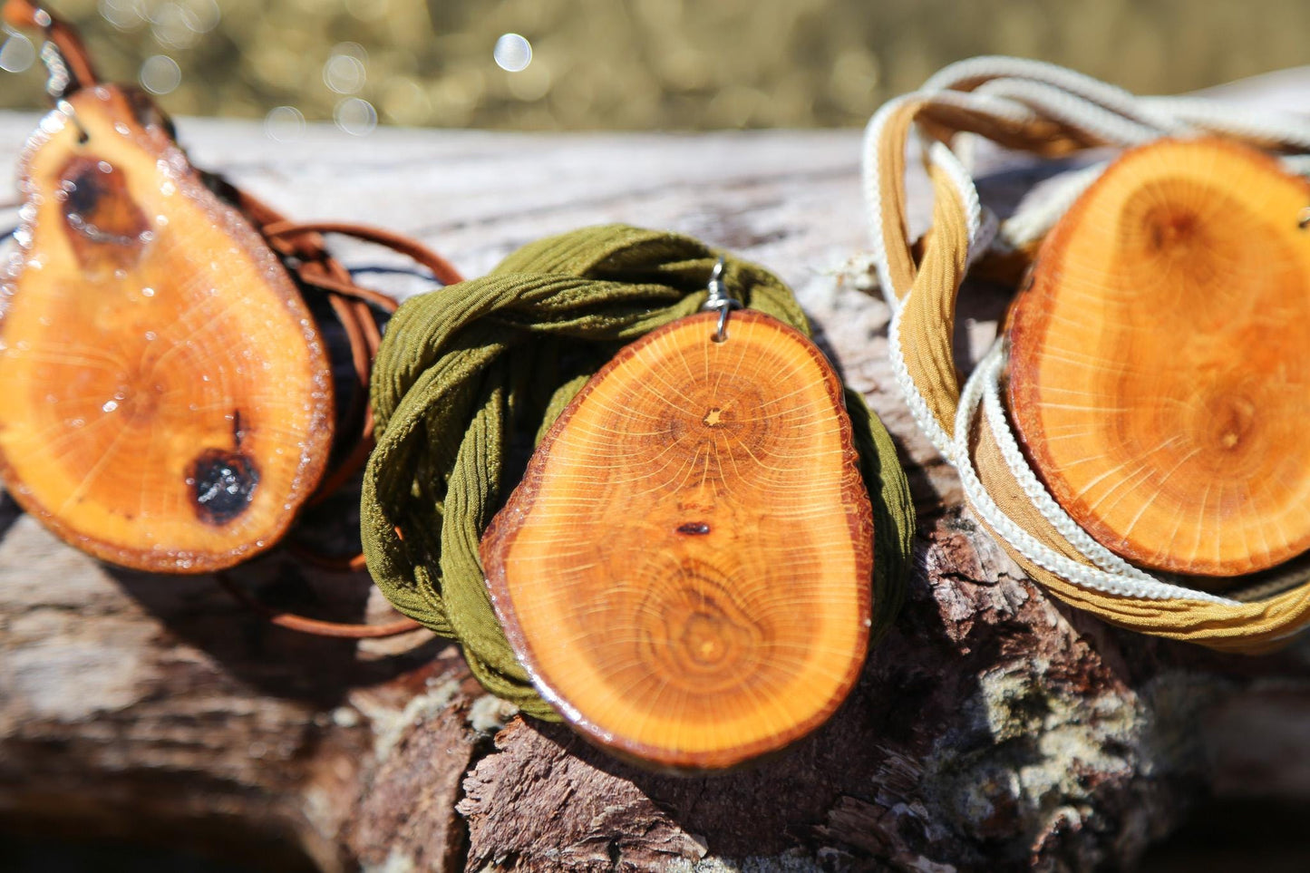 large wood slice necklaces hung from silk or leather / festival fashion / statement piece / boho jewelry / bohemian style necklace / earthy