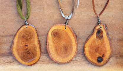 large wood slice necklaces hung from silk or leather / festival fashion / statement piece / boho jewelry / bohemian style necklace / earthy