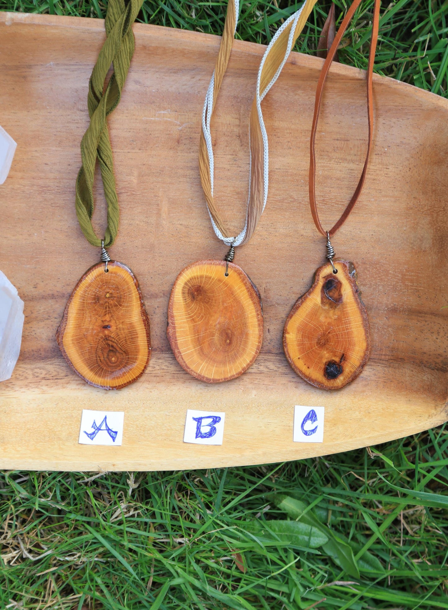 large wood slice necklaces hung from silk or leather / festival fashion / statement piece / boho jewelry / bohemian style necklace / earthy