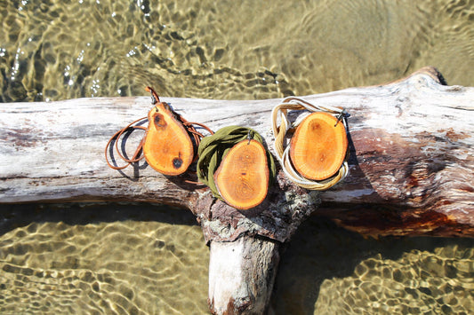 large wood slice necklaces hung from silk or leather / festival fashion / statement piece / boho jewelry / bohemian style necklace / earthy