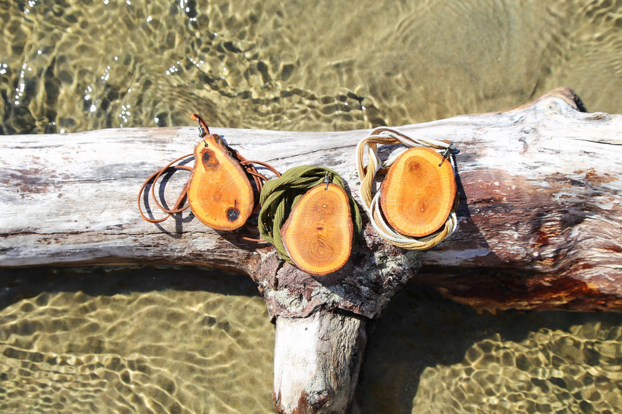 large wood slice necklaces hung from silk or leather / festival fashion / statement piece / boho jewelry / bohemian style necklace / earthy